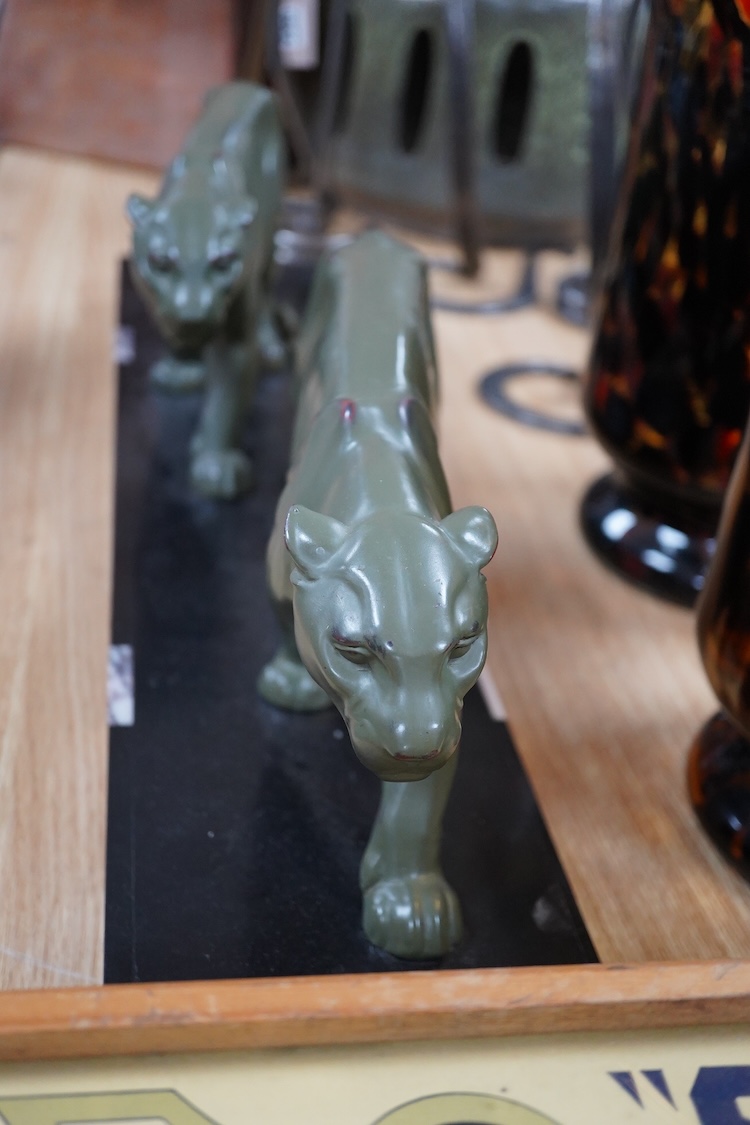 An Art Deco patinated spelter and marble figure of panthers, signed T. Cartier, 70cm